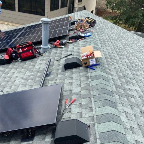 Roof mounted solar panel installation in progress by Elite Solar Solutions in Denver, CO